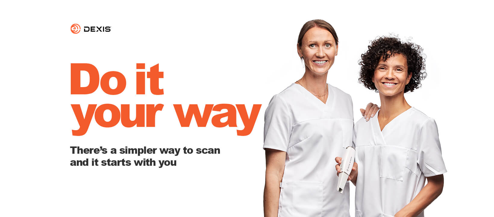 An advertisement banner for DEXIS featuring two female dental professionals in white scrubs standing side-by-side against a white background. The woman on the right holds a white dental scanner. On the left, bold orange text reads 'Do it your way,' with smaller black text below stating 'There’s a simpler way to scan and it starts with you.'
