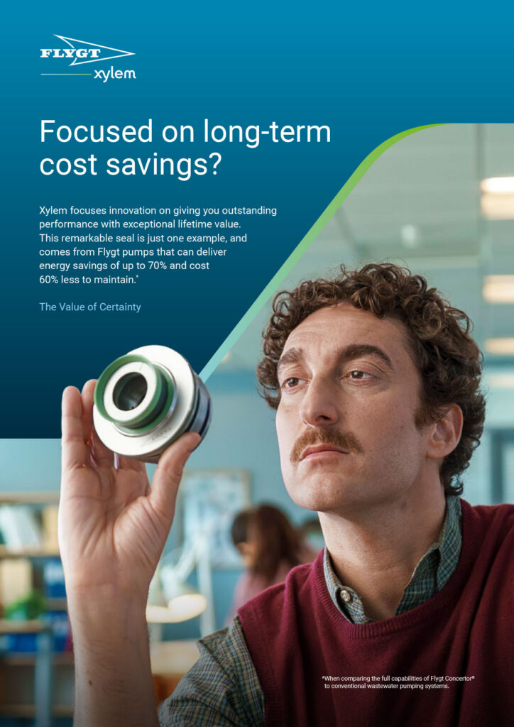 A full page ad featuring the Flygt and Xylem logos on a teal background. The headline reads 'Focused on long-term cost savings?' followed by informational body text. The main image shows a man with a mustache examining a metallic mechanical pump seal.